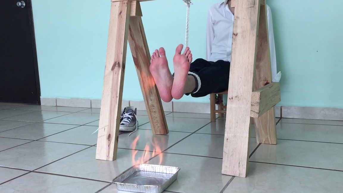 Surrendering her feet to the flames